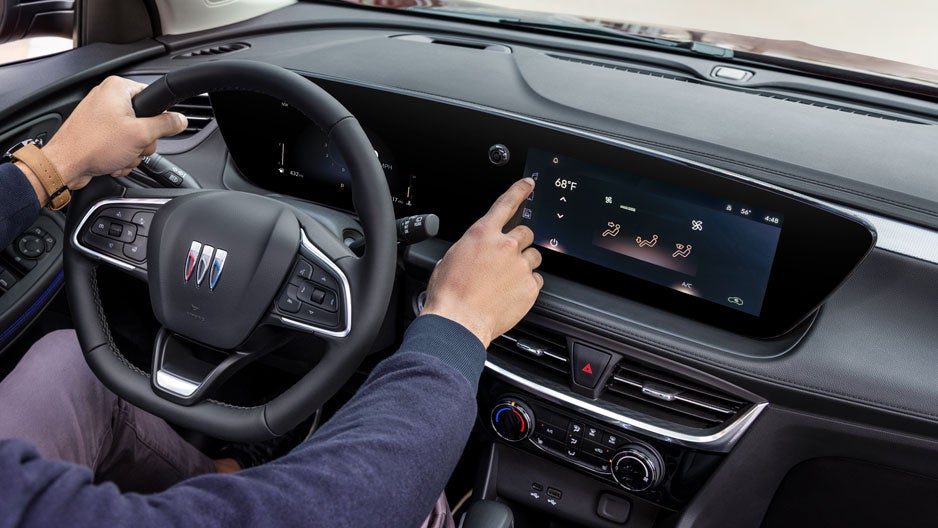 buick interior hands on steering wheel